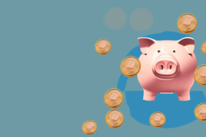 A piggy bank with coins spilling out of it